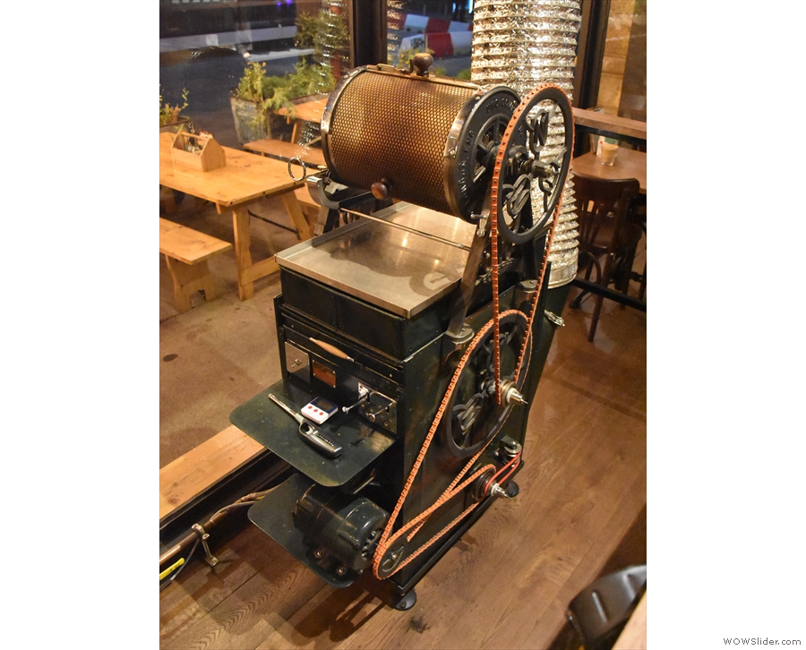 It's a fully working, vintage, open-flame drum roaster, maunfactured by Uno in 1919.