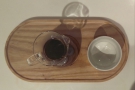 .. beautifully-presented on a wooden tray with a cup on the side.