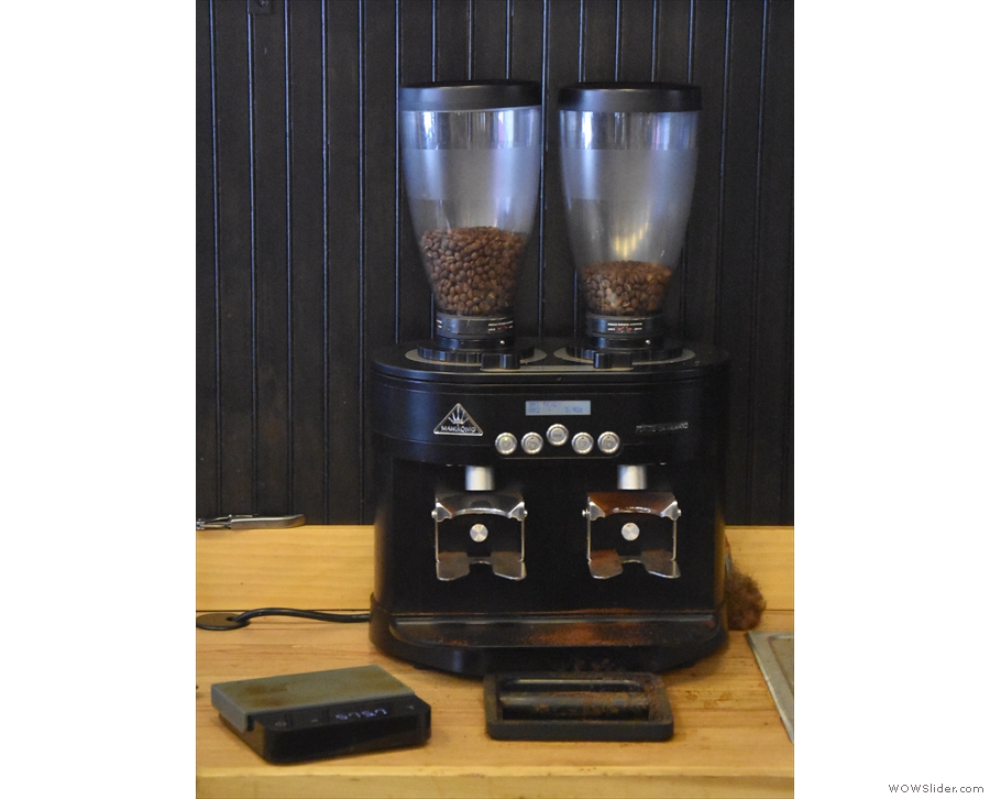 The twin Mahlkonig grinders house the Third Coast blend and the guest espresso...