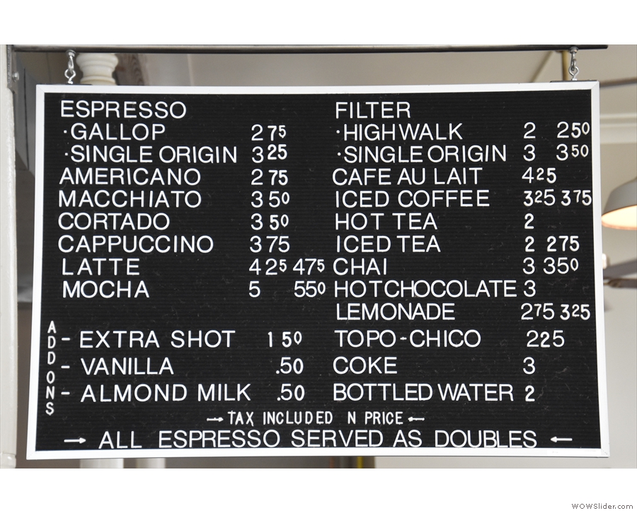 The coffee and drinks menu hangs high above the counter.