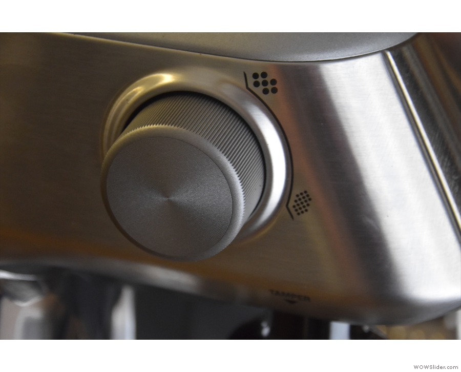 On the left-hand side, the grind adjustment wheel has been replaced by a large knob...