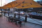 This row of tables lines the front, shaded by umbrellas, as seen here in 2015.