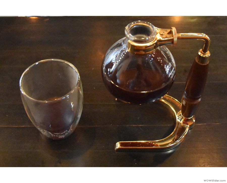 ... complete with the stand and a double-walled glass cup to drink it from.