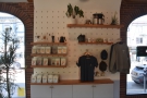 The retail shelves have the usual mix of retail coffee, coffee kit and merchandising.
