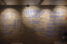 The menu is painted on the exposed brick of the left-hand wall.