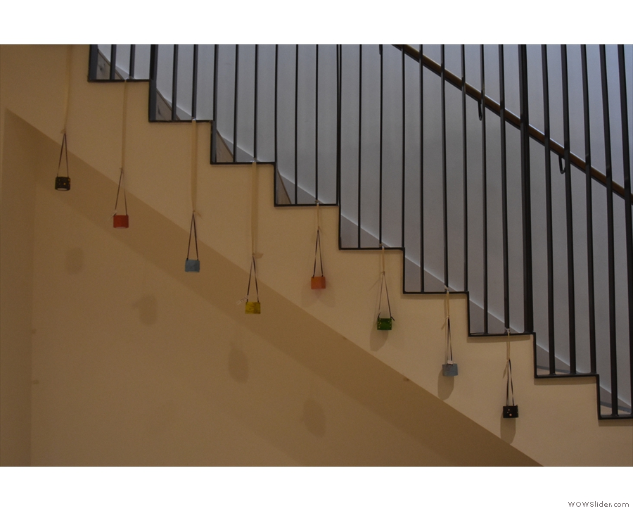 There's quite a bit of artwork downstairs, including these hanging from the stairs...