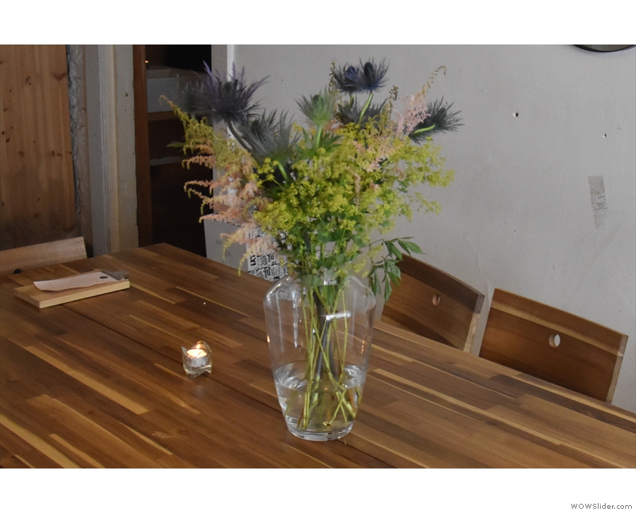 There are more candles, plus these lovely flowers, on the communal table.