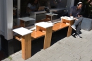 There's a little bit of outside seating in the shape of this bench, with in-built tables.