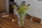 There are more candles, plus these lovely flowers, on the communal table.