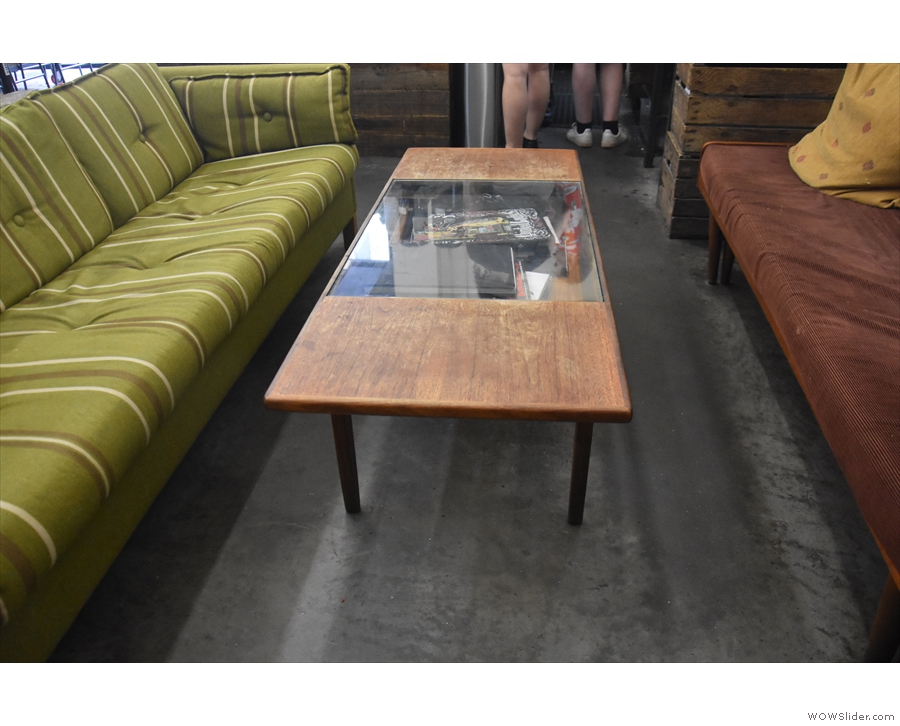 There's a low coffee table, with a pair of three-person sofas facing each other across it...
