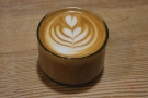 My flat white, in a short, cylindrical glass.
