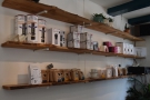 ... mix of coffee kit (middle shelf) and coffee beans (bottom shelf) for sale.