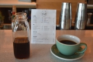 My coffee was served in a small bottle, cup on the side, just how I like it.