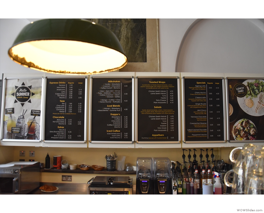 The main menus, meanwhile, are on the wall behind/above the counter...