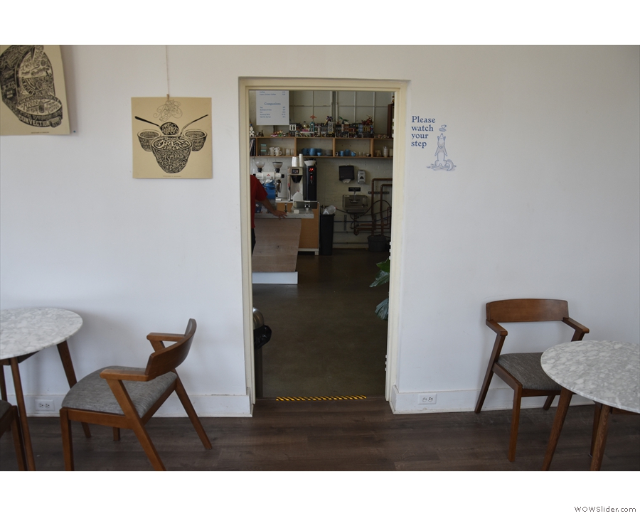 The open doorway in the left-hand wall leads through to the roastery/coffee shop...