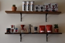 The retail shelves contain the usual mix of coffee equipment and retail bags of coffee.