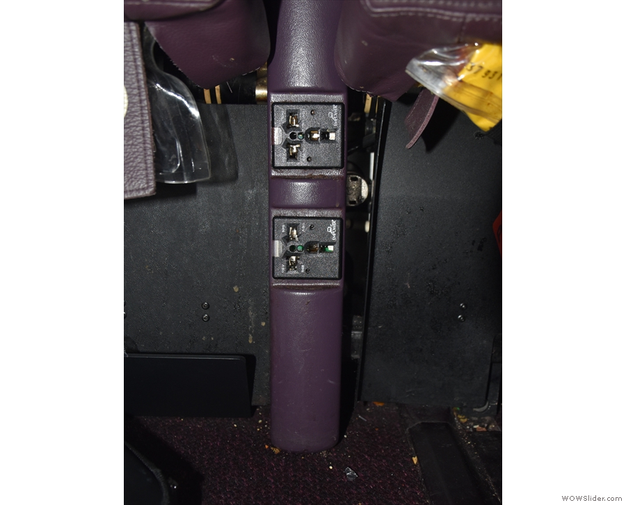 There is at-seat AC power, but it is really hard to get to, tucked away between the seats.