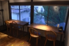 ... and a pair of two-person tables facing the windows overlooking the front of Hirano.
