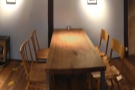 ... has a four-person communal table in the corner...