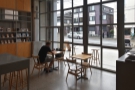There are also a pair of two-person tables in the window (and a row of stools outside).