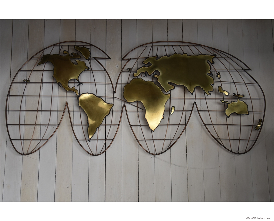 The % Arabica map of the world adorns the back wall above the roaster.