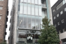 On a busy street in Gaienmae, stands this unremarkable six-storey building. However...