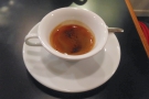 The espresso arrived first, served in a wide-brimmed demitasse cup...