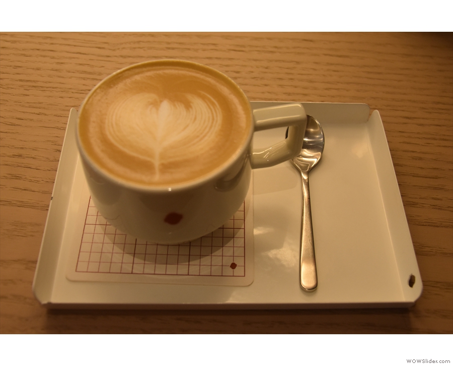 On my first visit, in July 2018, I tried a decaf flat white, served on a small, metal tray...