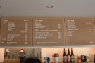 The menu, meanwhile, is on the wall behind/above the counter.