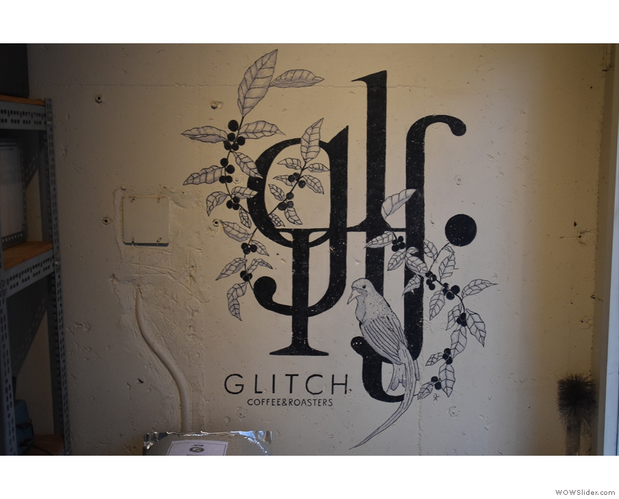 The Glitch logo is on the wall at the front of the roastery section.