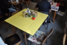 One of the bigger tables is this yellow one that sits in the middle of the room.