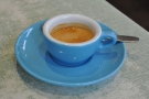 My espresso, in a lovely blue cup and over-sized saucer...