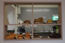 The cakes, meanwhile, are displayed to the right of the counter (with the kitchen behind).