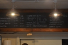 The drinks menu, meanwhile, is on the back wall above the counter.