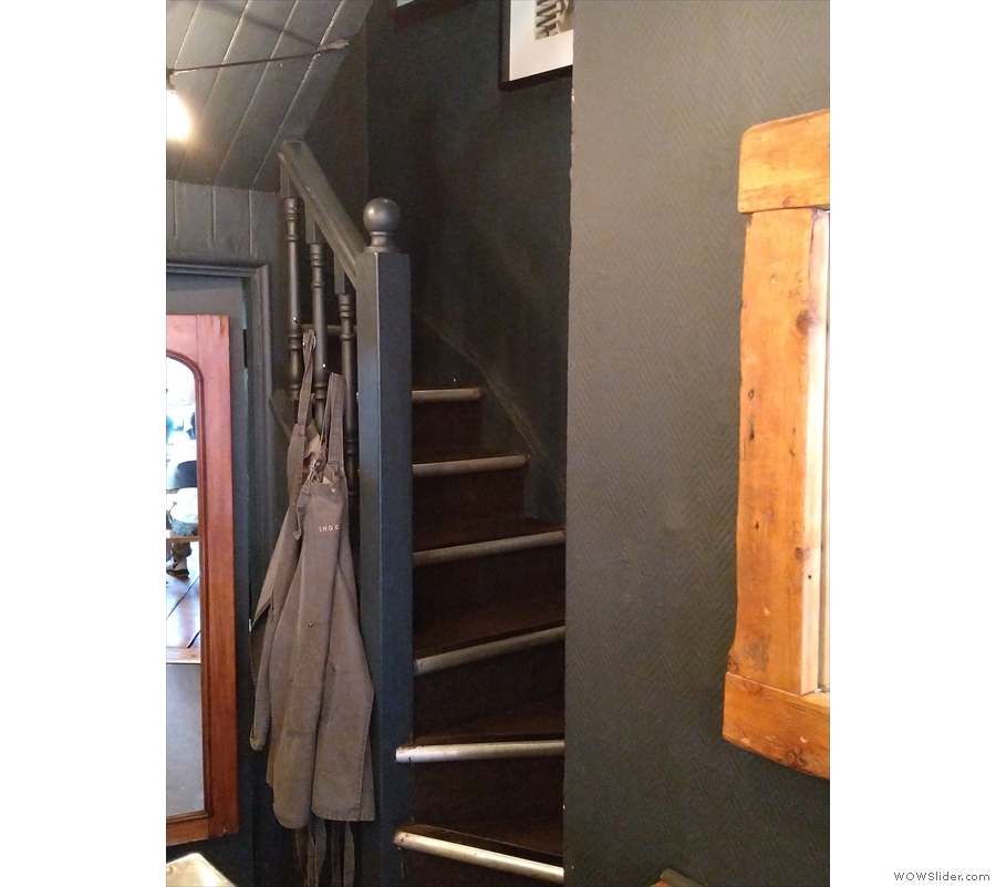 ... while in the right-hand corner, a staircase leads upwards. After a small landing at...