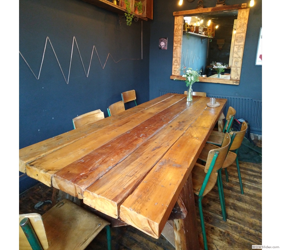 The remaining seating is provided by this magnificent eight-person communal table.