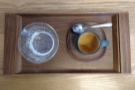 ... lovely Kinto cup, with a glass of water, it's beautifully presented on a small, wooden tray.