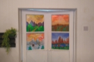 There is more painting on the doors to the kitchen behind the counter...