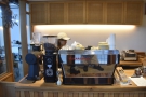 To business. The espresso machine and its two grinders are to the left of the counter...