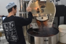 ... and then Yohei opens the flap at the bottom of the roaster...
