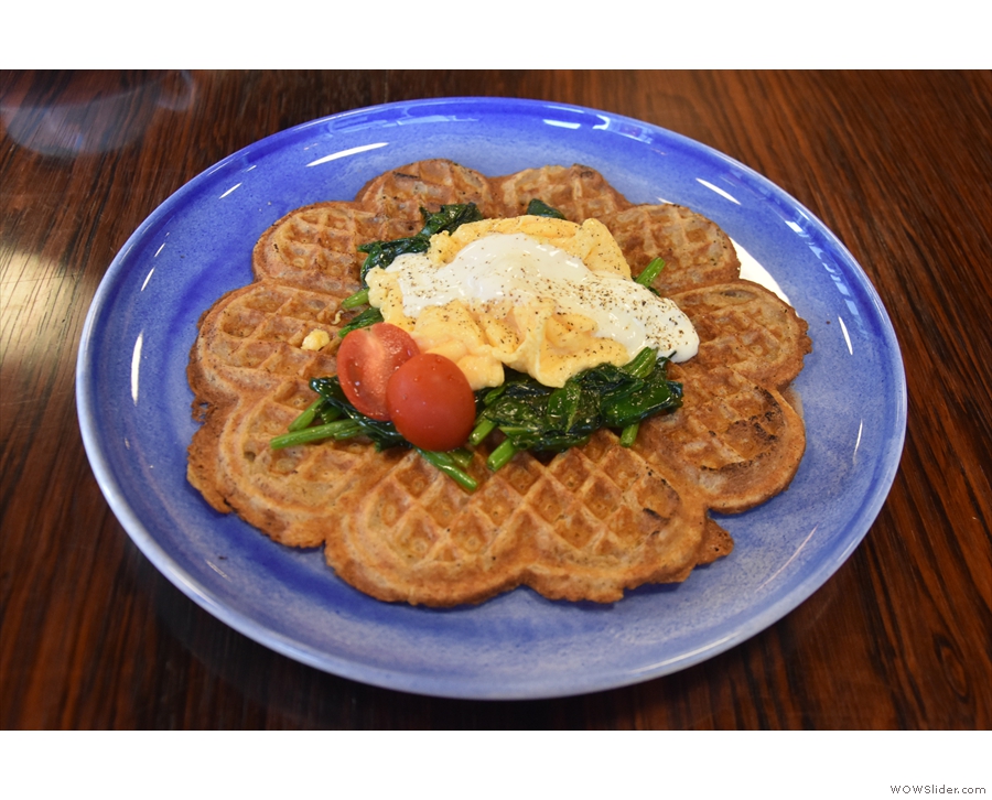 I was there for breakfast, having a waffle with scrambled eggs and spinach on top.