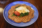 I was there for breakfast, having a waffle with scrambled eggs and spinach on top.