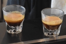 The two finished espressos, waiting for their milk.