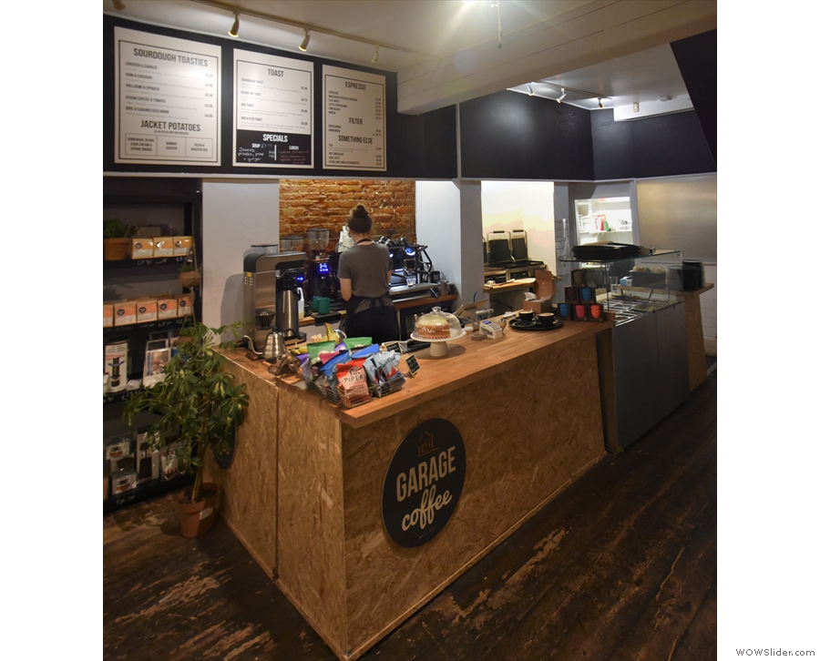 The counter, where you order, is at the back on the left-hand side, while further seating...