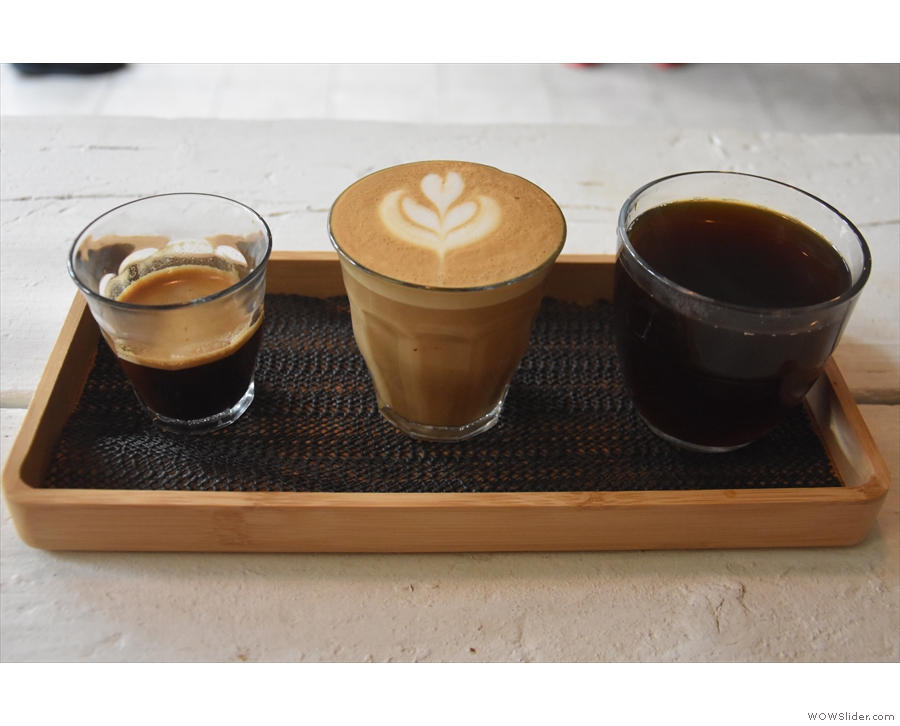 April: trying the coffee flight at Toro Coffee.