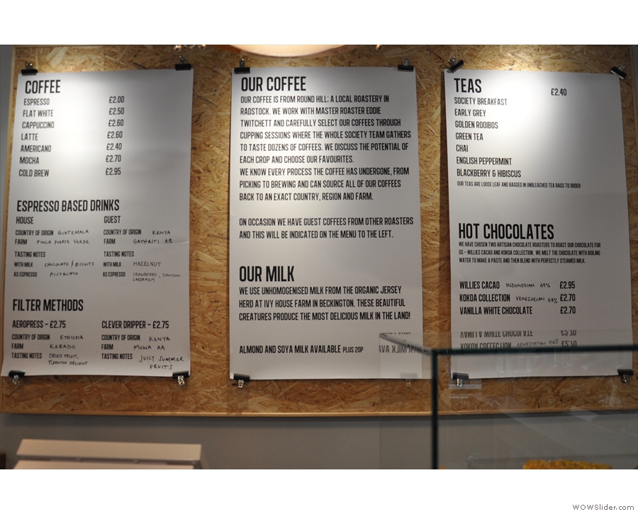 The menus hang on the wall behind the counter. This is what they looked like in 2014...