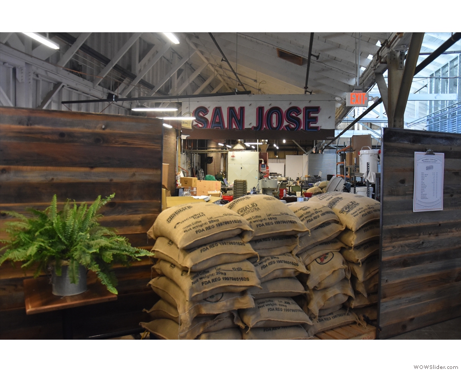 ... which continues to the left, where a pile of coffee sacks lets you see the roastery.