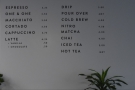 There's also a concise menu on the wall above the retail shelves...
