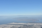... flying south of the Twin Peaks with the Golden Gate Park and Presidio in the distance...