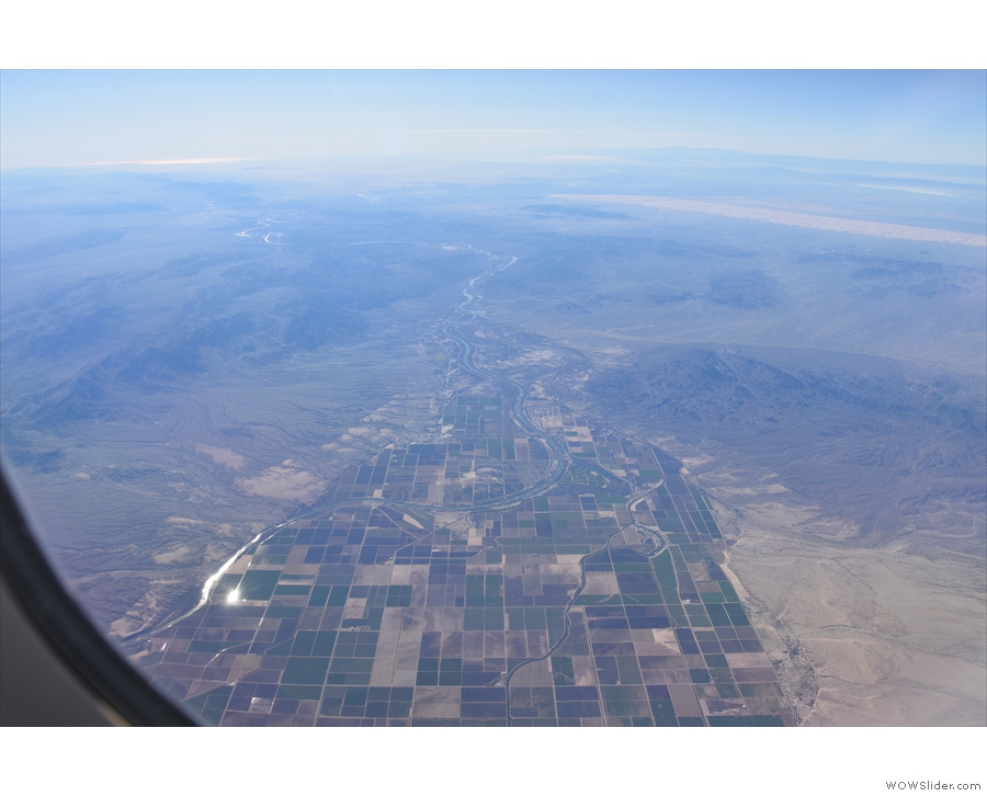 An hour into the flight and suddenly there's water and agriculture. This has to be...